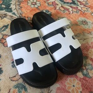 White and black sandals.